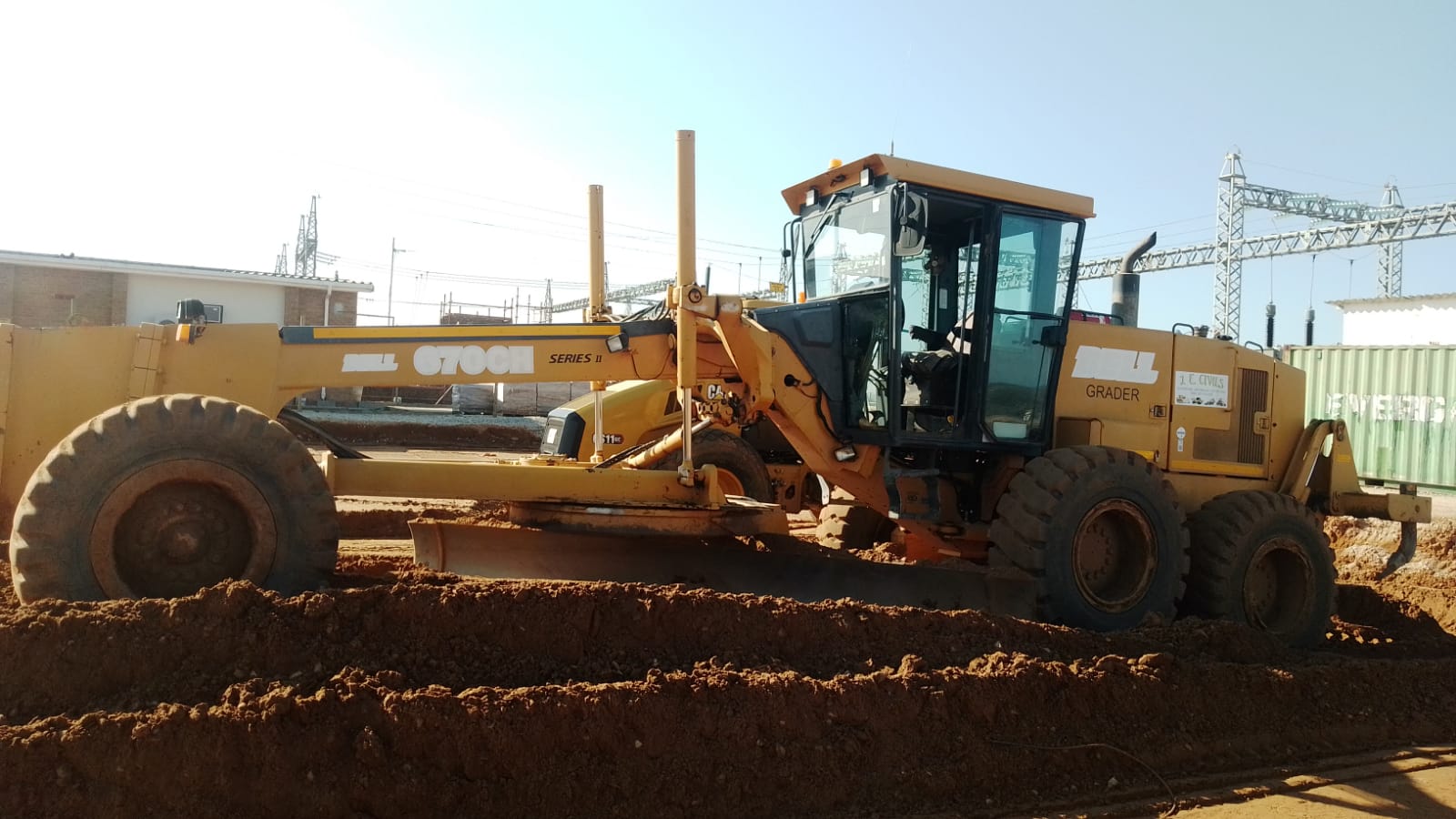 J.E. Civils grader preparing a gravel road surface